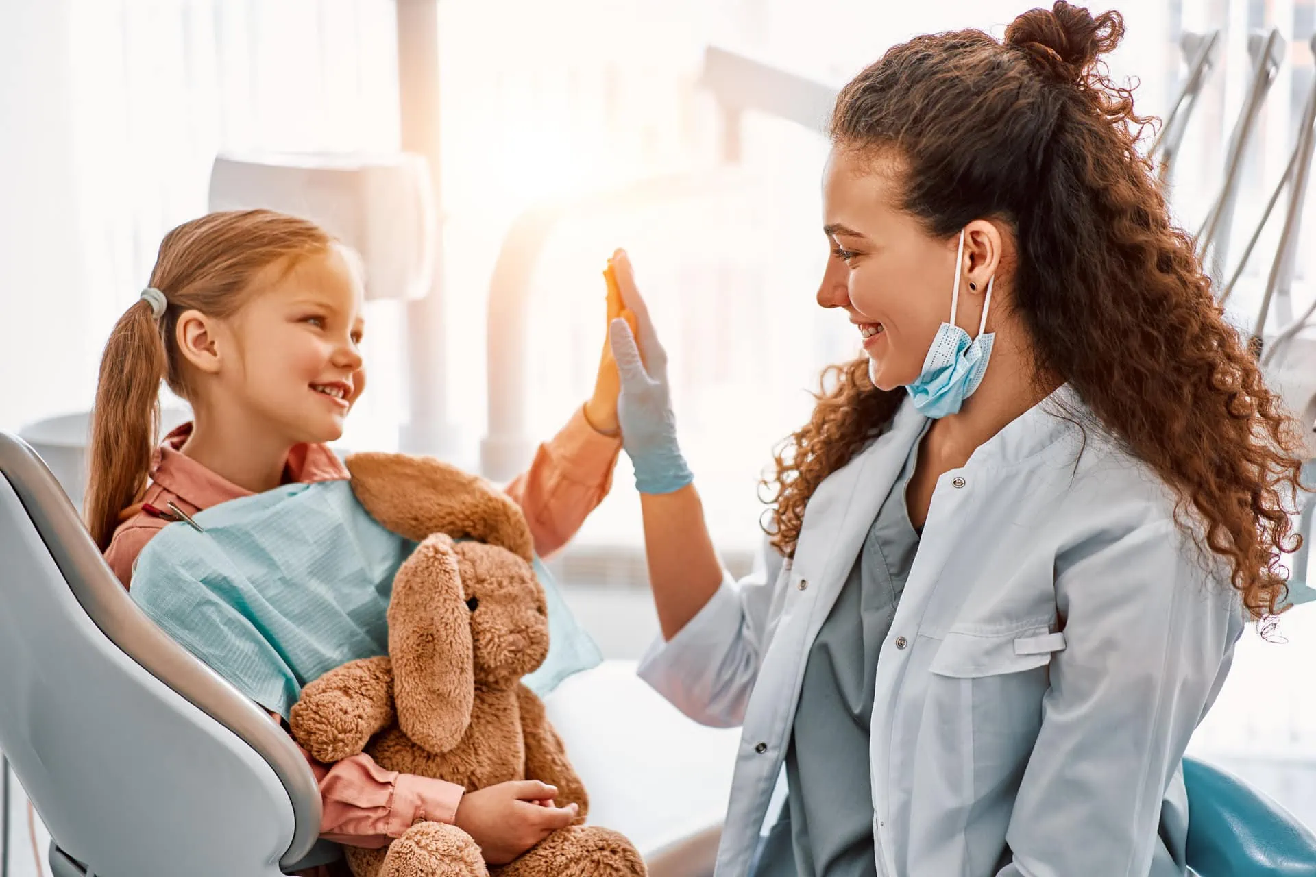 A calm, reassuring moment between a dentist and a nervous patient
